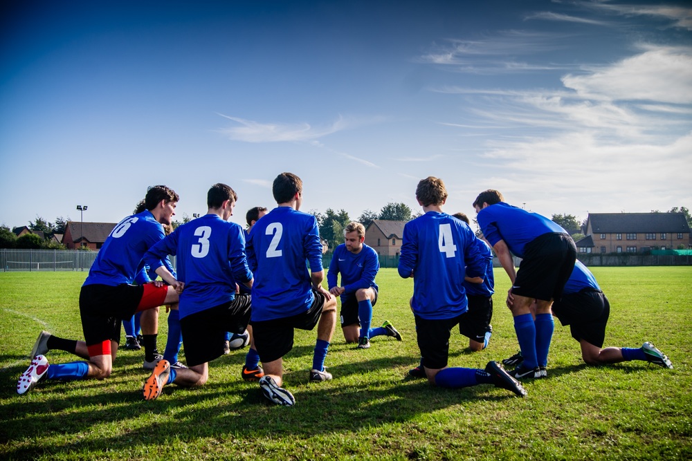 Football players huddled up